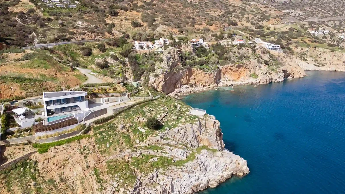 Aerial view of Meltemi Villa on the cliff above the Aegean